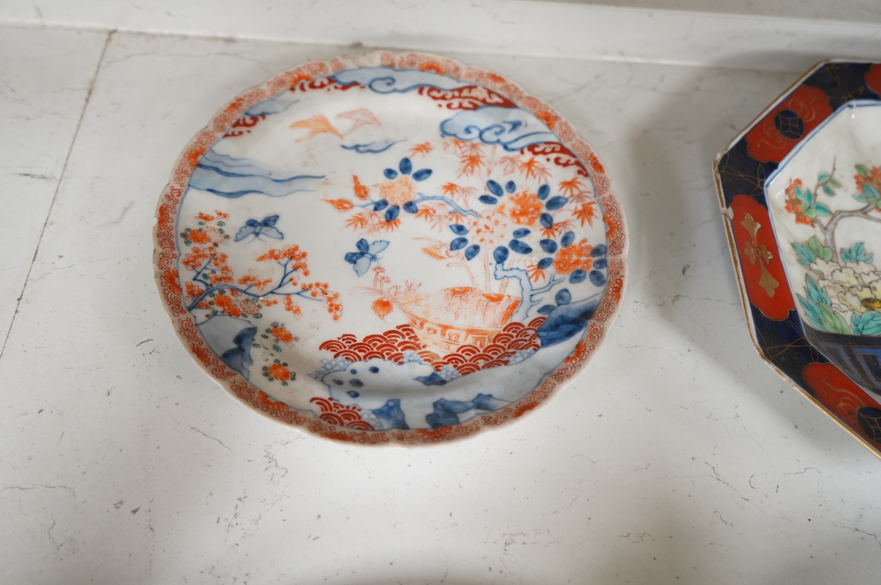 Six 19th century Japanese plates and a bowl, mostly Imari pattern, the octagonal dish with Koransha mark for Fukagawa, largest 24cm in diameter